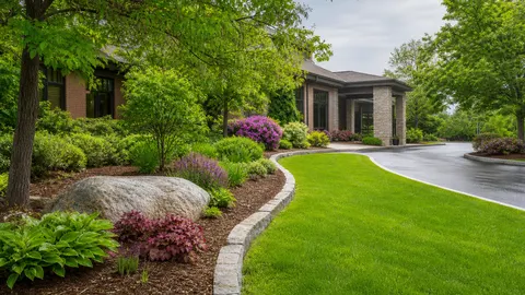 Professionally landscaped commercial property entrance with lawn and planting beds