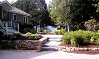 Granite Steps And Stone Retaining Wall To Patio