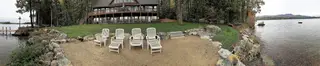 Panoramic Lakefront Patio With Lounge Chairs