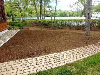 Waterfront landscape in installation phase with mulch beds