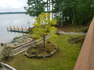 Waterfront landscape with new tree planting and hardscape features
