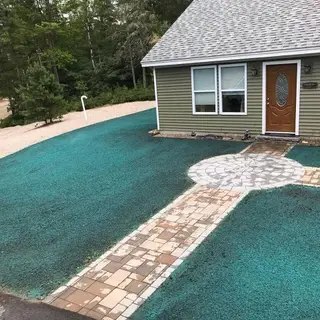 Hydroseeded front yard with paver pathway and plantings