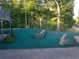 Hydroseeded Slope With Stone Wall And Boulder