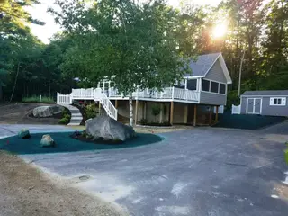 Hydroseeding installation on residential property with blue slurry coverage