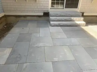 Bluestone patio with granite entry steps