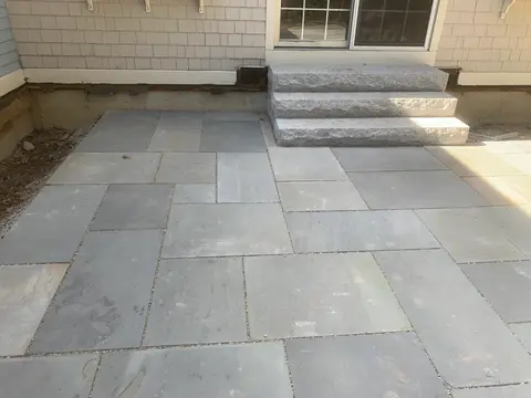Bluestone patio with granite entry steps