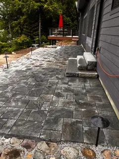 Bluestone tile wall with granite steps and lamp