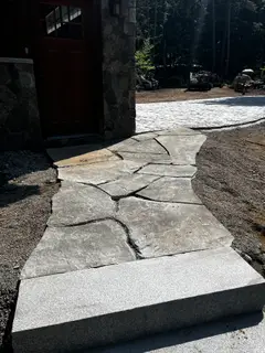 Close-up of granite step edge and bluestone slab