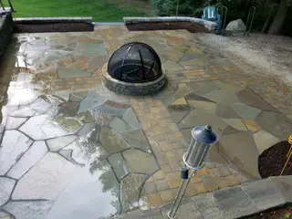 Combination paver and flagstone patio with fire pit
