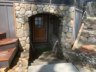Completed round stone entryway arch