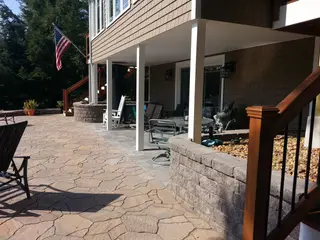 Covered stone patio with American flag