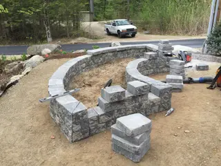 Curved block retaining wall under construction