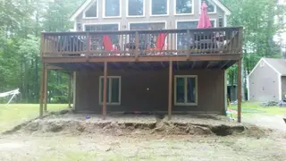 Excavated foundation beneath raised deck home