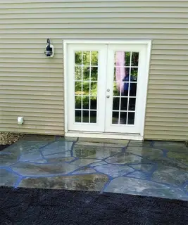 Flagstone patio at French door entry