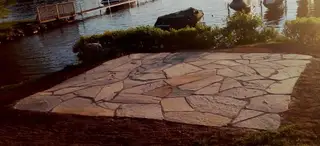 Flagstone patio overlooking boat dock