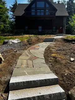Flagstone walkway with granite steps to house