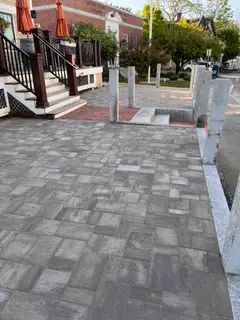 Granite bollard posts along downtown patio