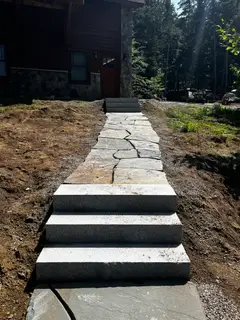 Granite bullnose steps leading to bluestone patio