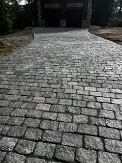 Granite cobblestone paving texture close-up