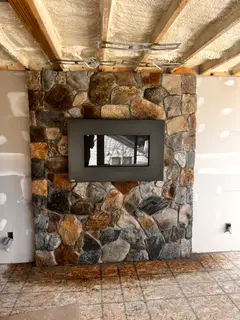 Pine Ridge masonry - indoor stone fireplace surround