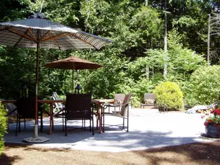 Shaded patio with dual market umbrellas