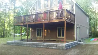 Stone foundation patio under raised deck