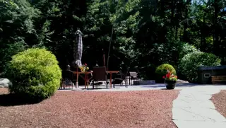 Wooded patio dining area with mulch surround