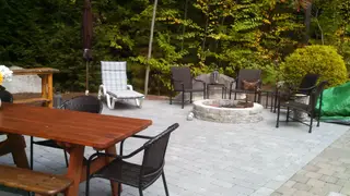 Wooded patio with fire pit and mixed seating