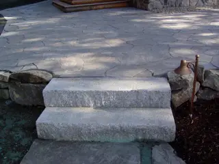 Bronze path light beside flagstone patio steps