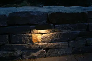Recessed light in stacked stone wall