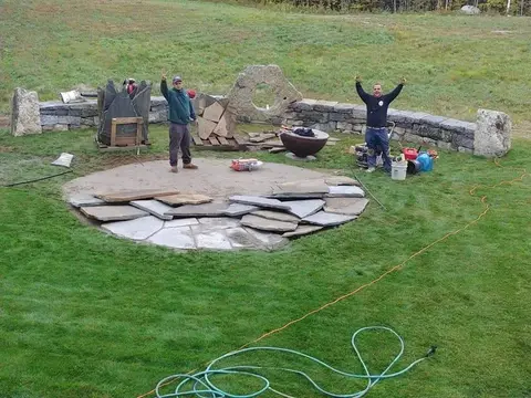 TLE crew celebrating a finished fire pit patio