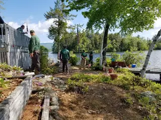 Crew installing lakeside deck lighting