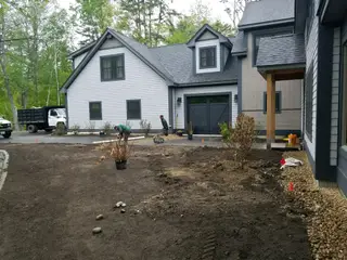 Crew planting shrubs at new home