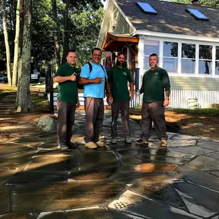 Crew posing on finished flagstone patio