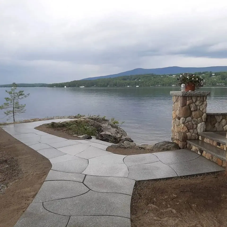 Lakeside flagstone walkway leading to stone steps