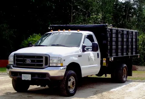 Company stake body work truck used for material delivery