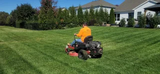 Professional lawn care work at a residential property
